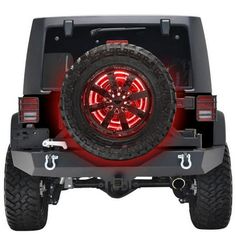 the rear end of a black jeep with red leds on it's tires