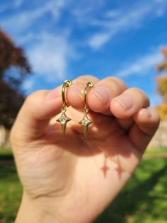 Materials:  Hoop- stainless steel (in gold color) Charm- 18k gold plated CZ star drop Item Details: The earrings are for 1 PAIR and only come in the CLIP ON version for NON PIERCED ears. These stainless steel clip on hoop earrings use a spring closure and look very realistic (like pierced earrings).  US customers: Receive FREE US shipping by making an order of $35 or above from my shop. Non-US customers: If you order multiple items from my shop at once, the shipping cost will be for one piece. I Dangly Clip On Earrings, Clip On Dangle Earrings, Aesthetic Clip On Earrings, Gold Clip On Earrings, Fun Jewelry Ideas, Earrings No Piercing, Earrings Space, Clip On Hoop Earrings, Fake Earrings