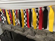 ribbons are hanging from the fireplace to dry off