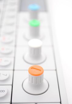 a close up view of the control buttons on a wii game controller, which is white and orange