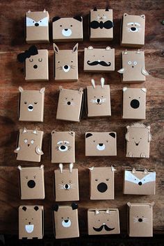 several boxes with different designs on them are arranged in the shape of animals and mustaches