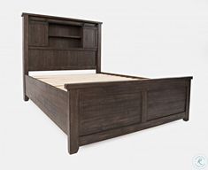 a wooden bed frame with an open headboard and foot board on the bottom side