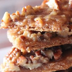 three cookies stacked on top of each other with walnuts and pecans in the middle