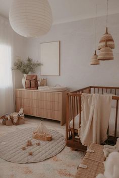 a baby's room with a crib and toys on the floor