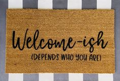 a welcome mat with the words welcome - ish and opens who you are on it