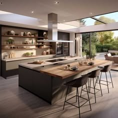 a modern kitchen with an island counter and chairs