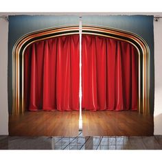 an open red curtain in front of a stage with wooden flooring and hard wood floors