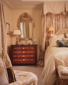 a bed room with a neatly made bed and a dresser