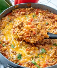 a skillet filled with ground beef and cheese