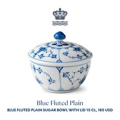 a blue and white bowl with a crown on top