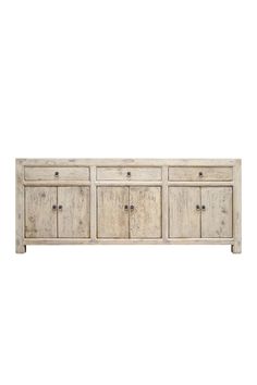 an old white wooden sideboard with four drawers