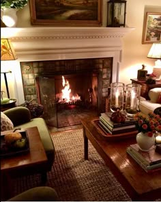 a living room filled with furniture and a fire place next to a painting on the wall