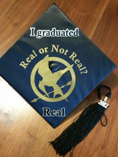 a graduation cap with the words real or not real on it