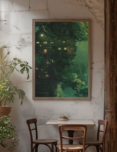 a painting hanging on the wall next to two chairs and a table with a potted plant