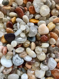 many different colored rocks and pebbles together