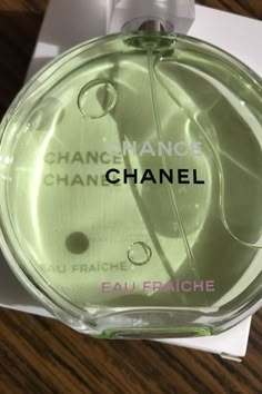 a bottle of chanel chancee eau fraiche on top of a table