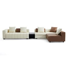 a white and brown couch sitting next to each other on top of a white floor