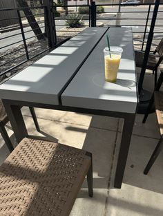 a table that has a drink on it