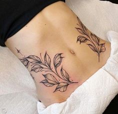 a woman's stomach with leaves on it