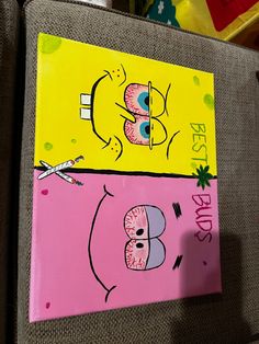 two paintings on canvases one is pink and the other is yellow, each have different faces