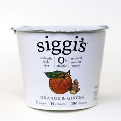 an orange and ginger yogurt in a plastic cup on a white background with the words siggi's o