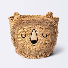 an animal shaped basket with a face on it