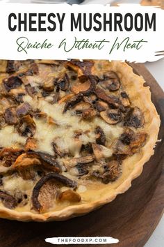 Cheesy mushroom quiche with a golden, flaky crust, creamy egg filling, and sautéed mushrooms, offering a rich, meat-free dish perfect for breakfast or brunch.