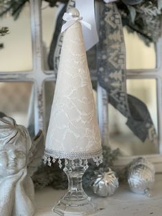 a white christmas tree sitting on top of a table