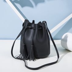 Brand Name: macrouptaShape: BucketHandbags Type: Shoulder BagsTypes of bags: Shoulder Crossbody BagsOrigin: CN(Origin)Main Material: PUClosure Type: STRINGHardness: HARDExterior: NONEStyle: FashionLining Material: PolyesterOccasion: VersatileGender: WOMENPattern Type: SolidNumber of Handles/Straps: SingleInterior: No PocketDecoration: Tassel Simple Crossbody Bag, Retro Shoulder Bag, Drawstring Bucket Bag, Tassels Fashion, Girls Handbags, Crossbody Messenger Bag, Leather Bucket Bag, Leather Bucket, Mini Handbags