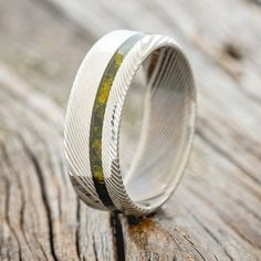 a wedding band that has been made to look like it is in the middle of a wood