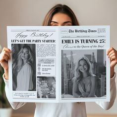 a woman holding up a newspaper with photos on it