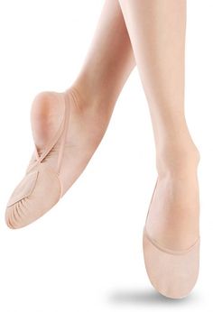 a woman's feet in ballet shoes on a white background