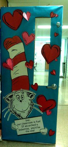 the cat in the hat door is decorated with hearts and has a message on it