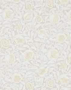 a white and beige wallpaper with flowers on the side, in an ornate pattern