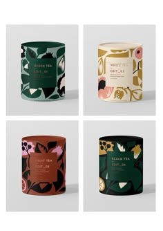 four tea tins with different designs on them