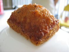 a piece of food sitting on top of a white plate