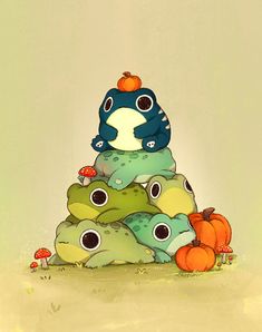 a pile of little monsters sitting next to each other on top of a pile of pumpkins