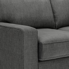 a close up view of the back end of a gray couch with black legs and arms