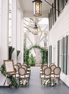 chairs are lined up on the front porch for an outdoor wedding ceremony in charleston, sc