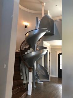 a spiral staircase in the middle of a house