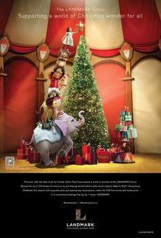 an advertisement for landmark's christmas tree and presents in front of a circus tent