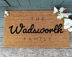 a welcome mat with the words, the wadsworth family and flowers on it