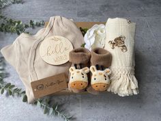 a baby gift box with booties, blanket and diaper