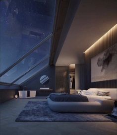 a large bed sitting under a skylight in a bedroom