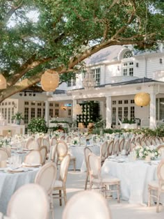 an outdoor wedding venue with tables and chairs