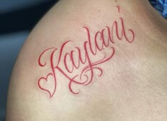 a close up of a person's tattoo with the word kauau on it