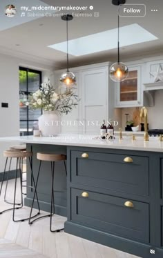 an image of a kitchen island with stools