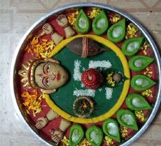 a metal bowl filled with green and yellow items