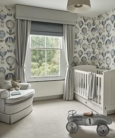 an image of a baby's room with wallpaper and curtains