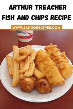 a white plate topped with fried fish and chips